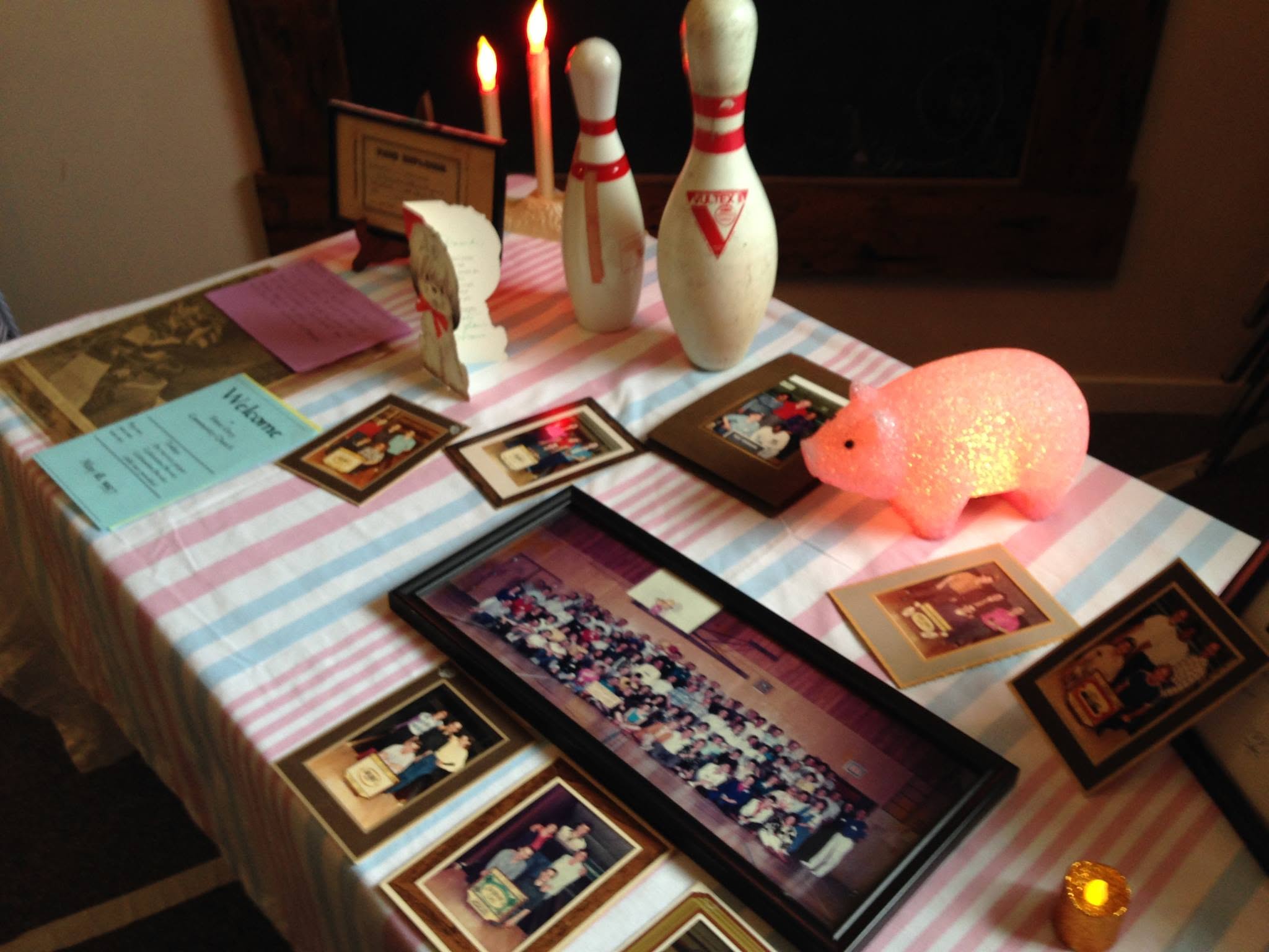 Memorial table with bowling pins, photographs, and Dave's personal items